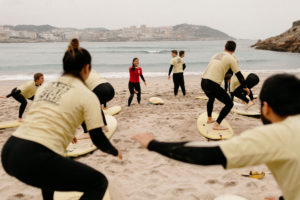 Base Surf Camp surf lesson on beach in Spain