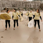 Girls heading out to surf in A Coruna, Spain