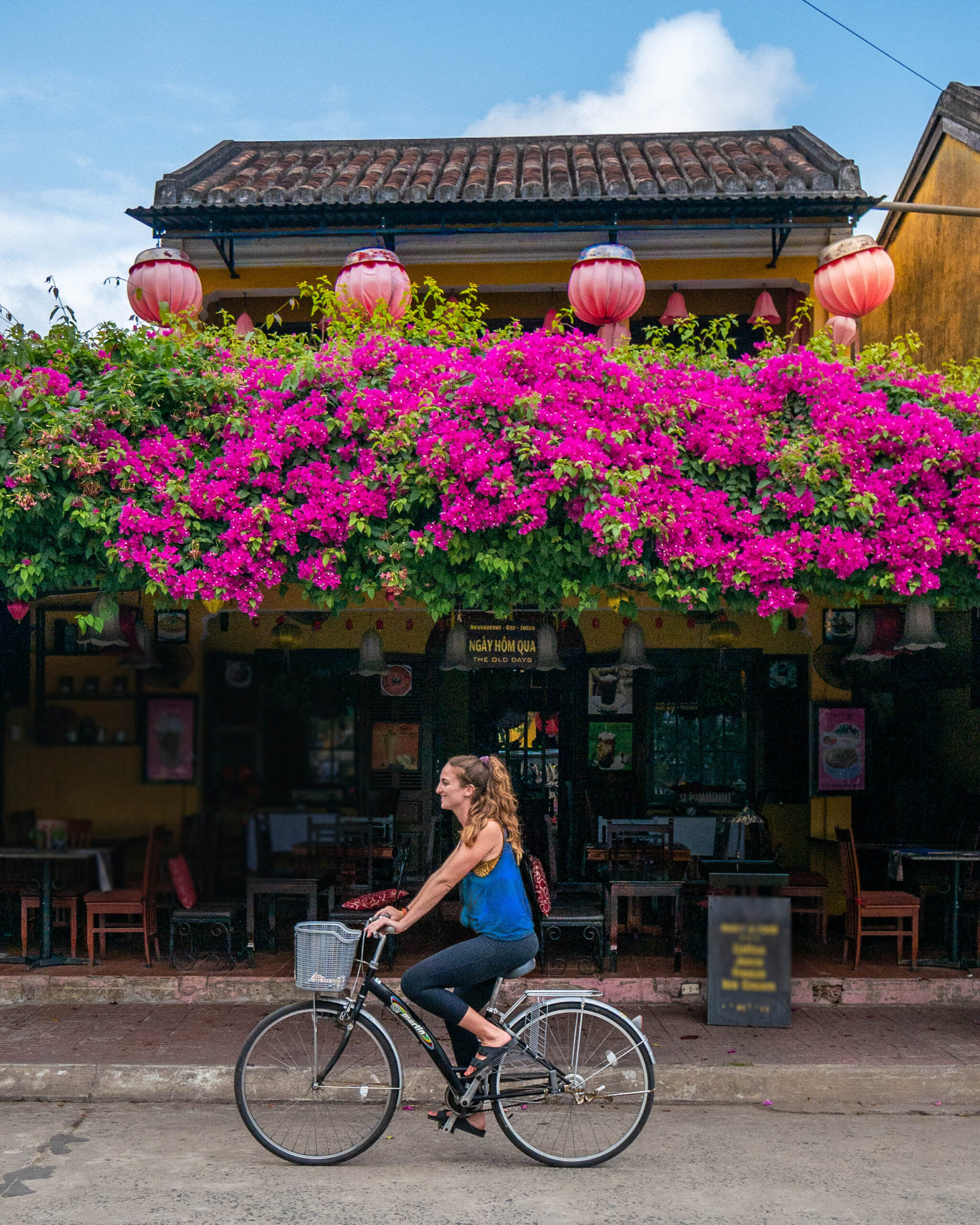 Solo travel woman biking in Hoi An, Vietnam 